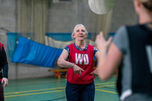 Senior woman playing netball